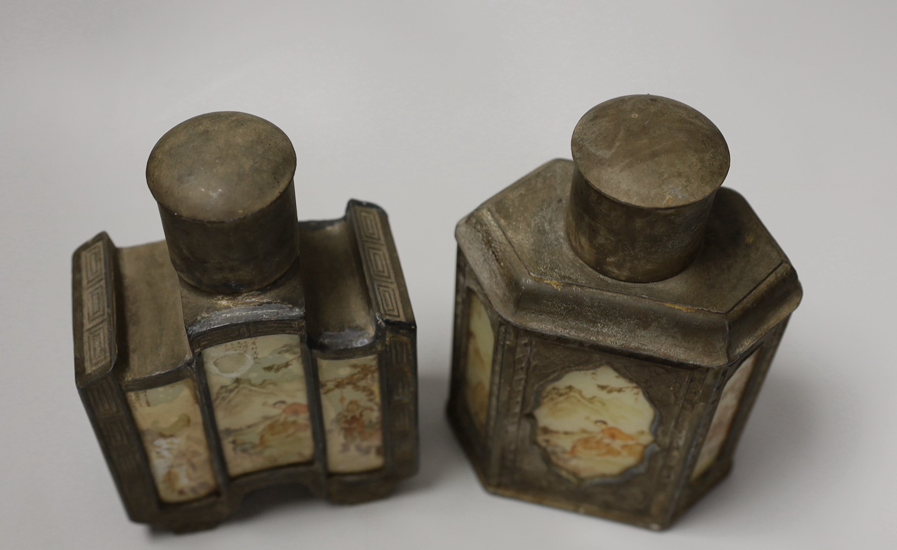 Two Chinese pewter tea caddies with glass panelled decoration. 18cm high